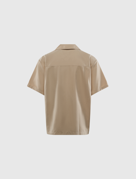 Back view of a beige short sleeve streetwear shirt on white background