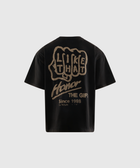 Black streetwear t-shirt with bold beige graphic and text on the back, casual men's apparel