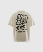 Men’s beige streetwear t-shirt with bold black graphic text and handprint design on back