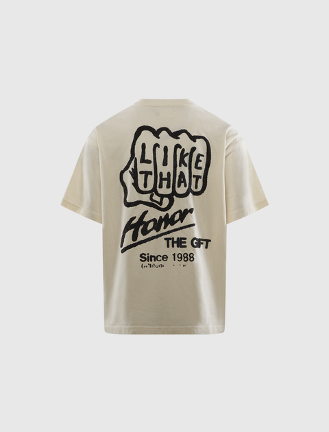 Men’s beige streetwear t-shirt with bold black graphic text and handprint design on back