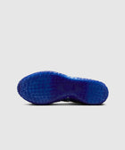 Blue textured sneaker outsole with star traction pattern on white background