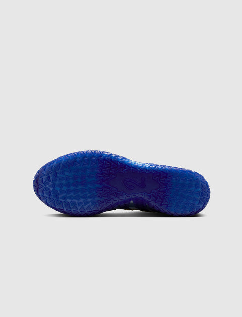 Blue textured sneaker outsole with star traction pattern on white background