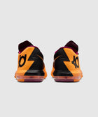 Back view of orange and black athletic sneakers with bold zigzag pattern and visible logo
