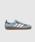 Blue and green suede sneaker with white stripes, gum sole, adidas logo on heel