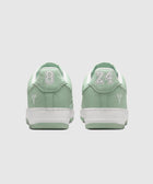 Mint green low-top sneakers with white soles, embroidered 8 and 24 on heels