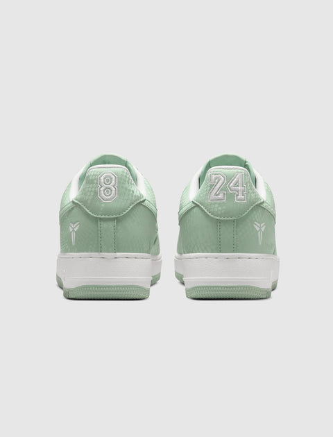 Mint green low-top sneakers with white soles, embroidered 8 and 24 on heels