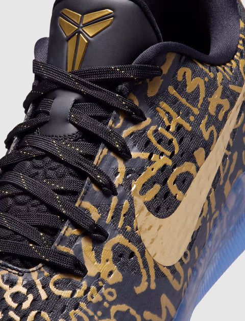 Black and gold basketball sneaker with abstract gold details, mesh upper, and gold swoosh logo
