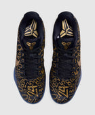 Black and gold patterned basketball sneakers with abstract numbers and metallic accents, top view