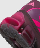 Close-up of magenta adidas sneaker heel with textured sole and bold cushioning
