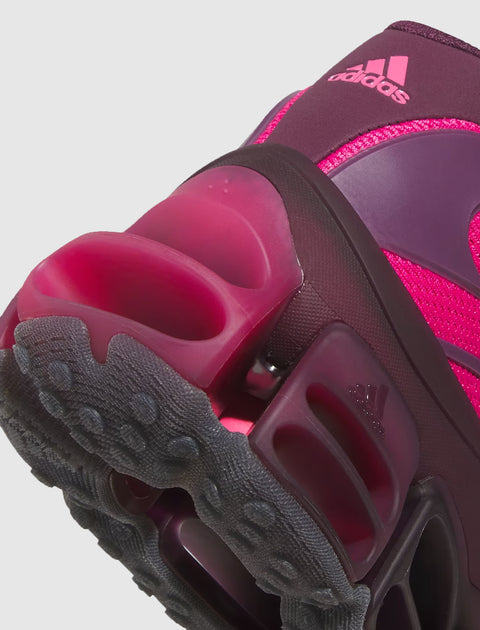 Close-up of magenta adidas sneaker heel with textured sole and bold cushioning