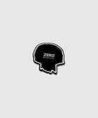 Black skull-shaped patch with white border and 'ZERO pleasures' text on light background