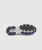 Black and blue athletic sneaker sole with textured grip on white background