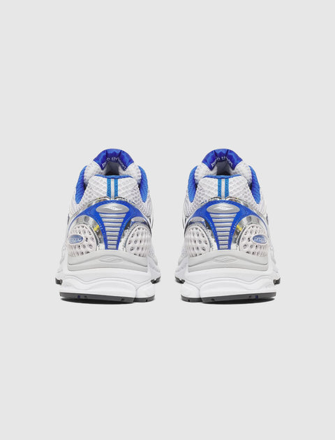 Back view of white and blue mesh athletic sneakers with chunky sole on light background