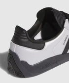 Close-up of black and white Adidas Samba sneaker heel with textured sole and branding