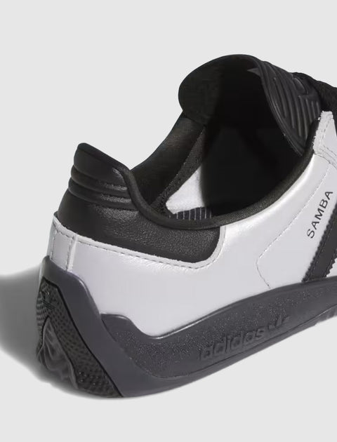 Close-up of black and white Adidas Samba sneaker heel with textured sole and branding