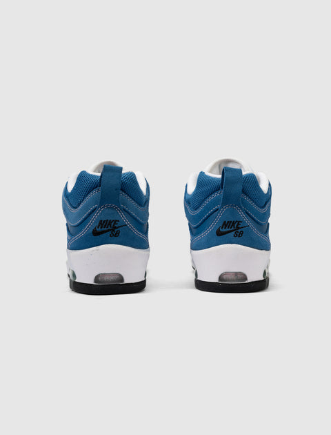 Blue and white Nike SB sneakers rear view, visible logo, white midsoles, grey background