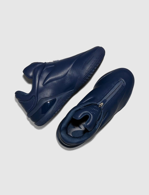 Men's navy blue leather sneakers with zipper detail, modern streetwear footwear