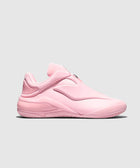 Pink low-top sneaker with futuristic design and molded rubber sole on grey background