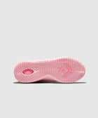 Pink sneaker sole with textured grip pattern and star logo on a light background