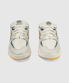Front view of white and green sneakers with TIAGO 1010 label, mesh and suede details