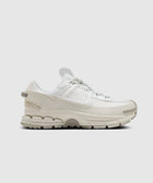 All-white men's streetwear sneaker with textured sole and layered design on clean background